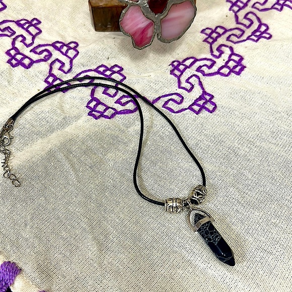 Jewelry - This black stone with white swirls is highly blessed